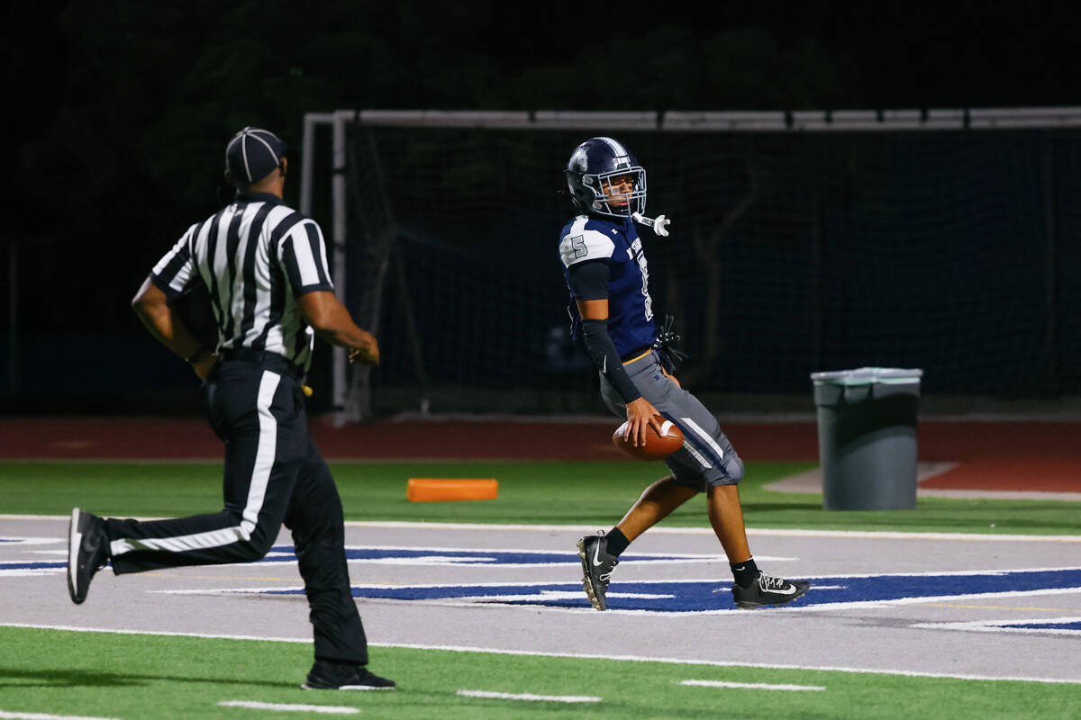 Shadow Ridge’s Isaiah Ruiz (5) runs the ball in for a touchdown unopposed during the gam ...