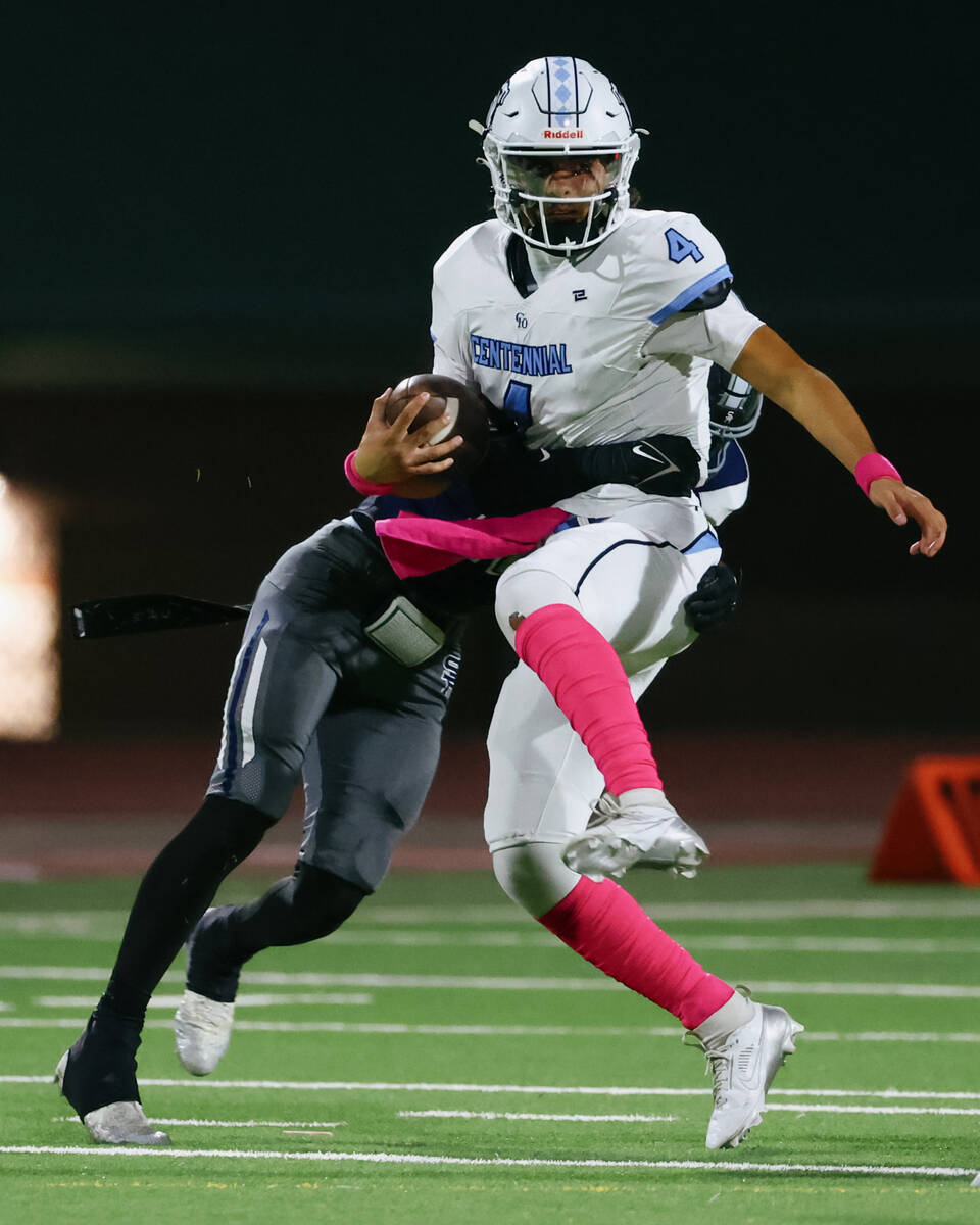Shadow Ridge’s Kawika Kalani (10) sacks Centennial quarterback Ashton Hunt (4) during th ...
