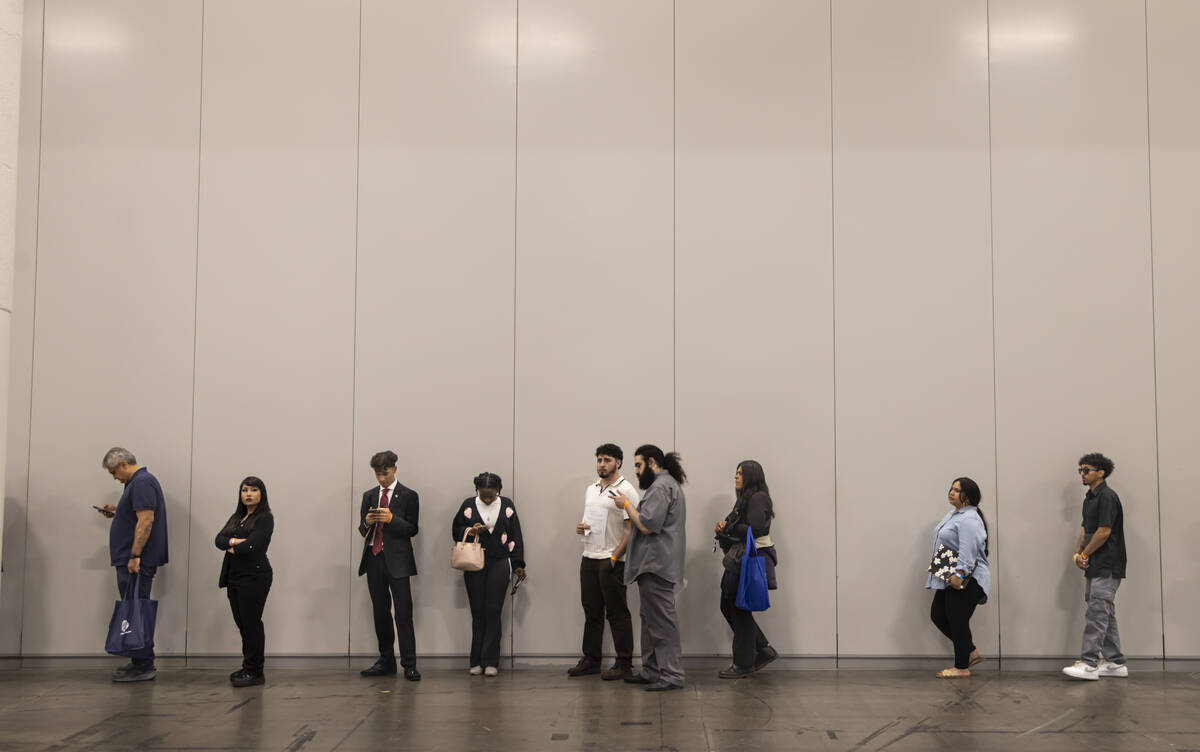 Attendees line up for interviews during the spring job fair at the Las Vegas Convention Center ...