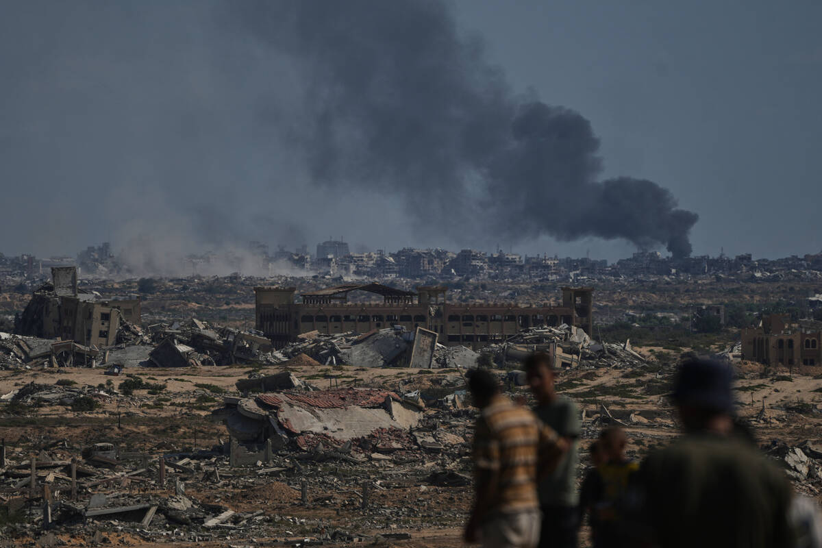Smoke rises to the sky following an Israeli military strike in Gaza City, as seen from the cent ...