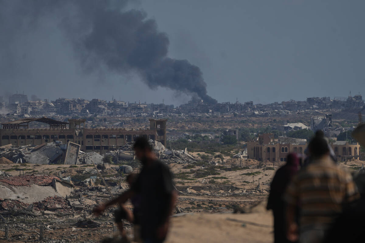 Smoke rises to the sky following an Israeli military strike in Gaza City, as seen from the cent ...