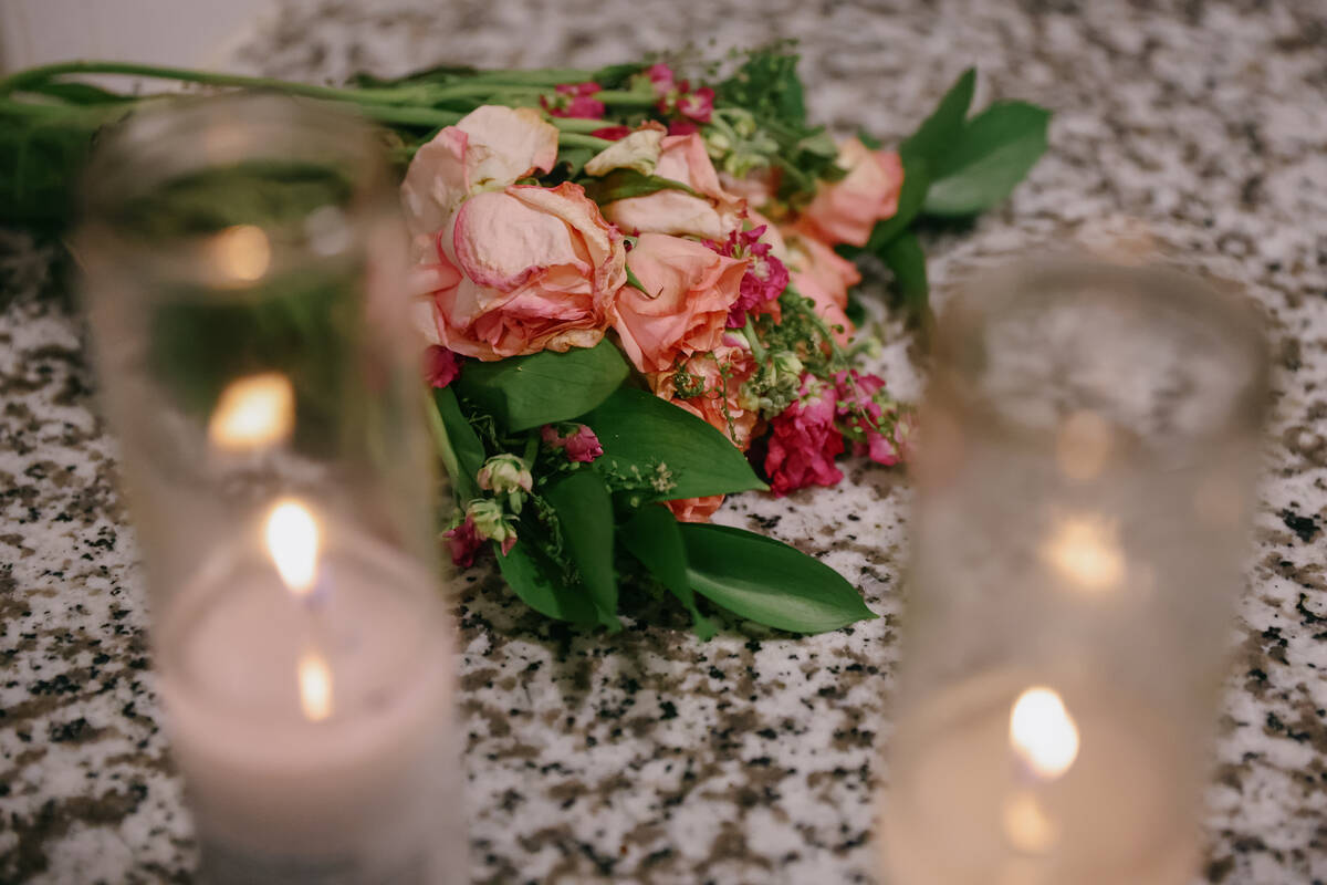 Flowers and candles sit in the apartment on Friday, Oct. 3, 2025 in the apartment where 27-year ...