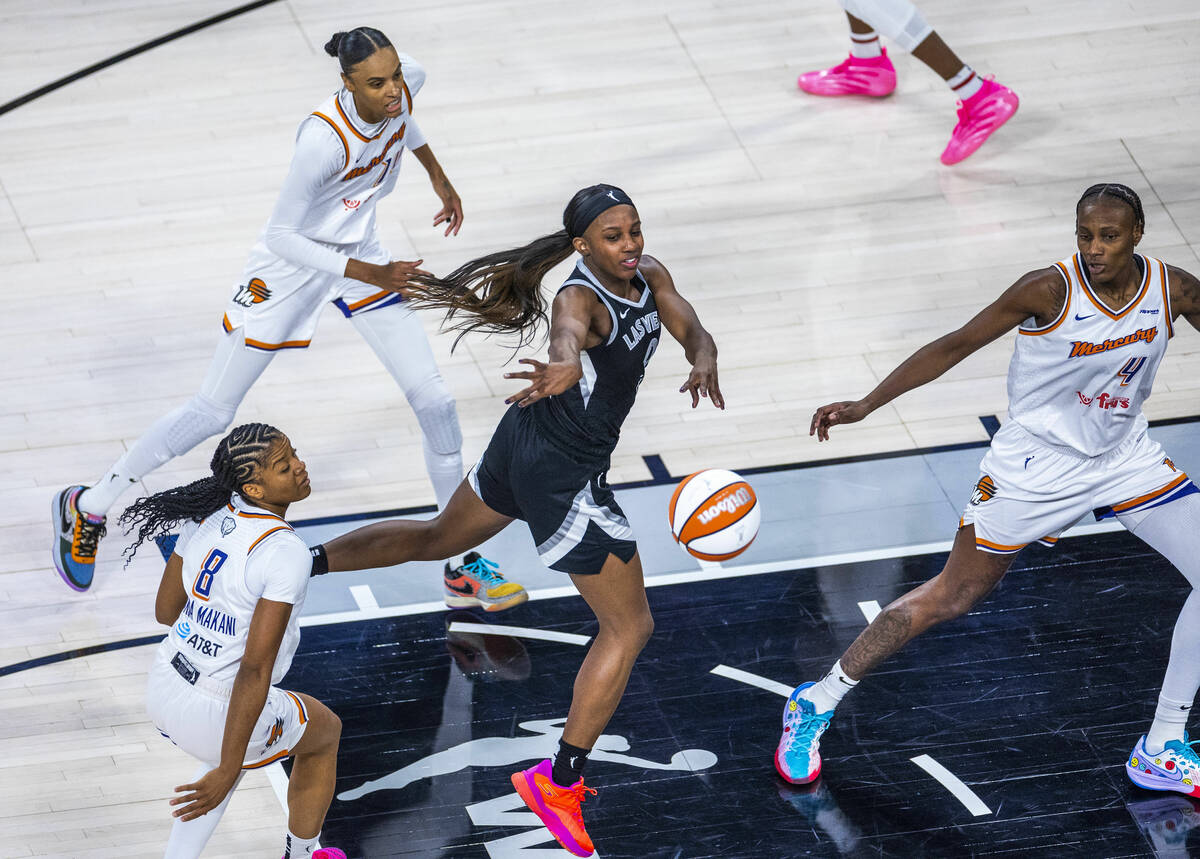 Aces guard Jackie Young (0) passes amongst Phoenix Mercury players during the first half of gam ...
