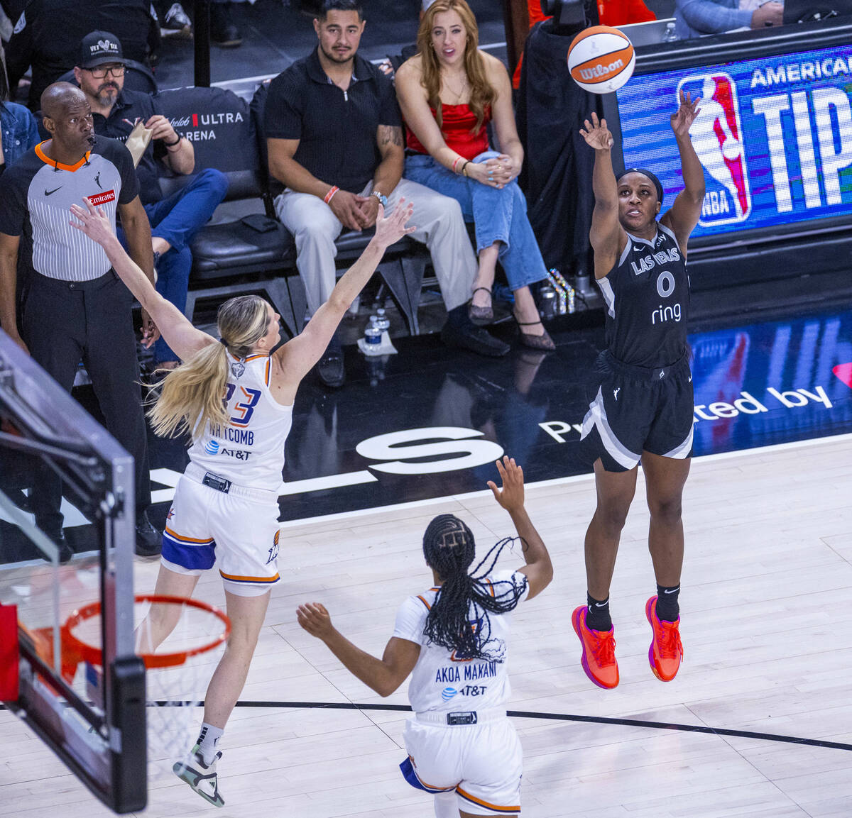 Aces guard Jackie Young (0) elevates for another three-point basket over Phoenix Mercury guard ...