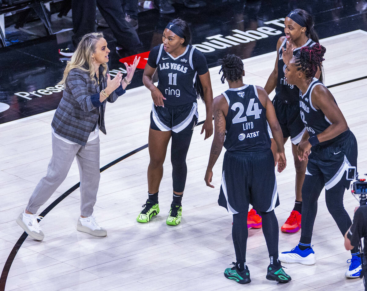Aces head coach Becky Hammon talks with her players on a time out against the Phoenix Mercury d ...