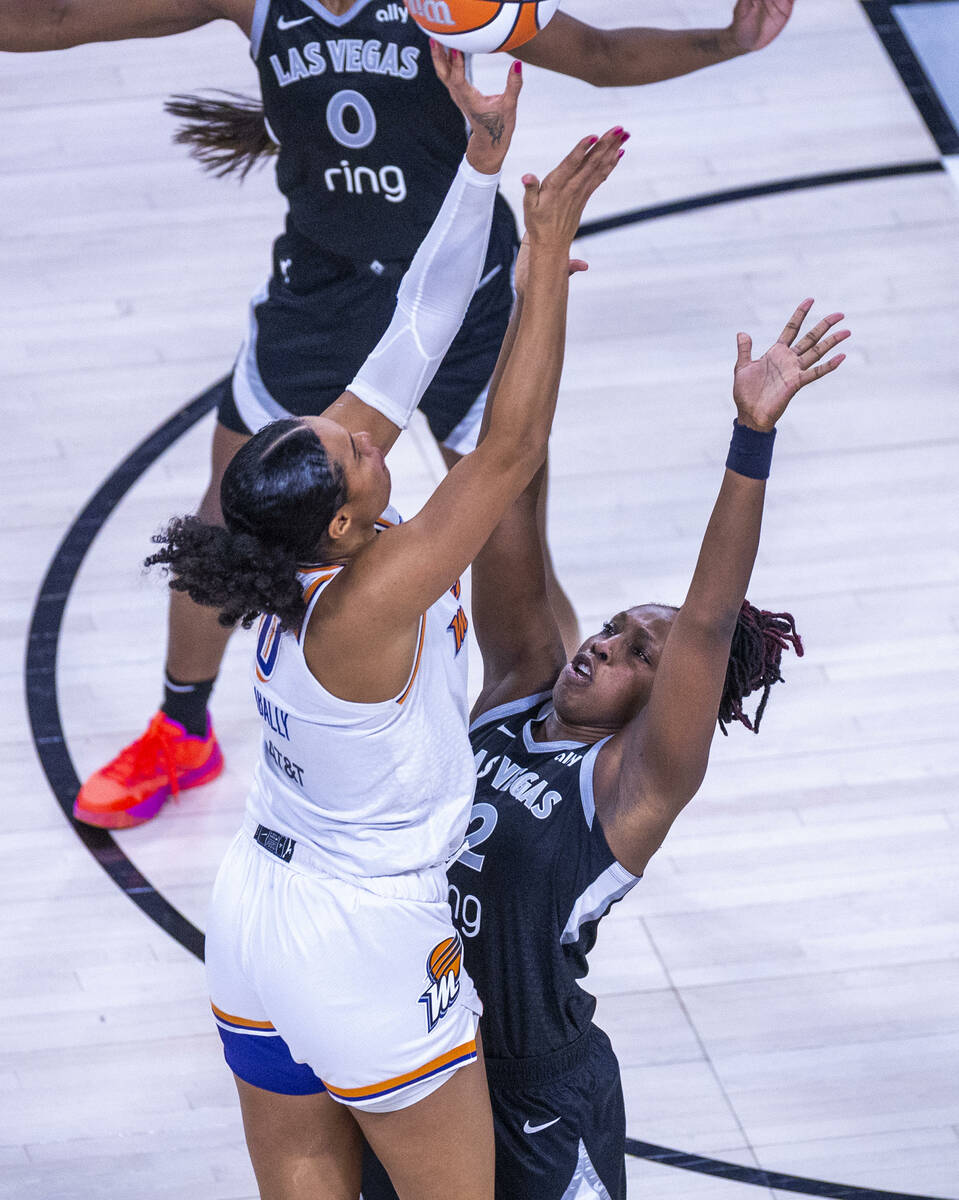 Phoenix Mercury forward Satou Sabally (0) is defended on her last missed shot by Aces guard Che ...