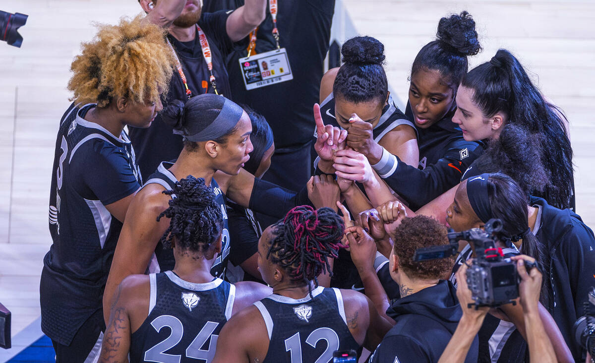 Aces center A'ja Wilson (22) signals one to her teammates as they huddle after defeating t ...