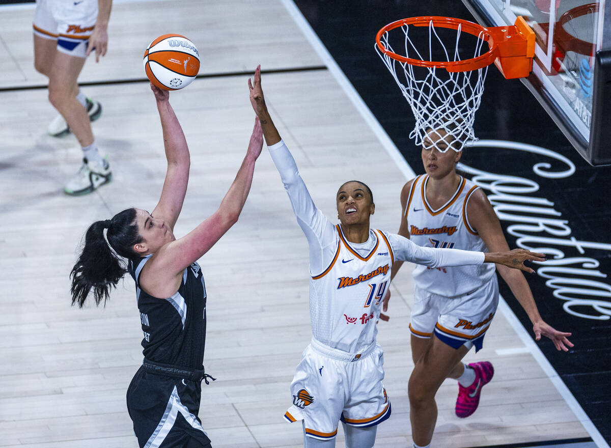 Aces center Megan Gustafson (17) elevates elevates to attempt a shot over Phoenix Mercury forwa ...