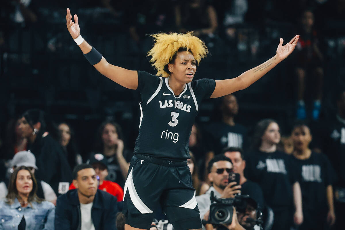 Aces forward NaLyssa Smith reacts to a foul called by a referee during game one of a WNBA final ...