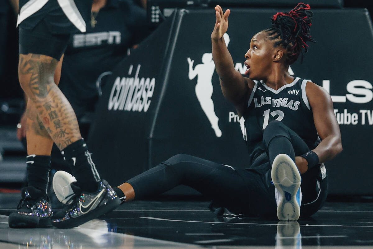 Aces guard Chelsea Gray points towards the Aces side of the court after a call by a referee dur ...
