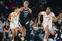 Aces center A'ja Wilson (22) dribbles the ball down the court during game one of a WNBA fi ...