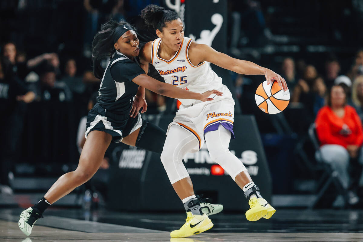 Aces guard Dana Evans (11) truest swipe the ball from Phoenix Mercury forward Alyssa Thomas (25 ...