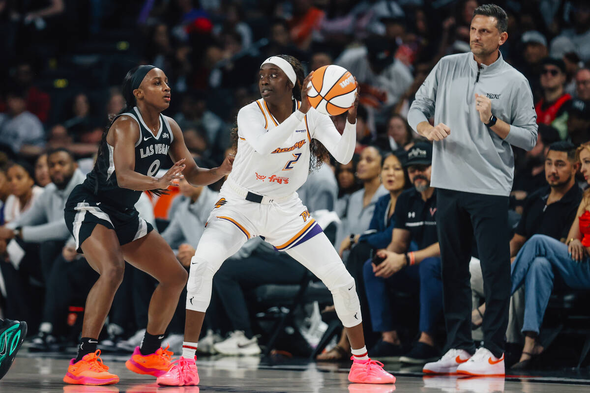 Aces guard Jackie Young (0) guards Phoenix Mercury guard Kahleah Copper (2) during game one of ...
