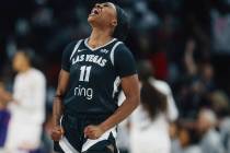 Aces guard Dana Evans celebrates during game one of a WNBA finals basketball game between the A ...