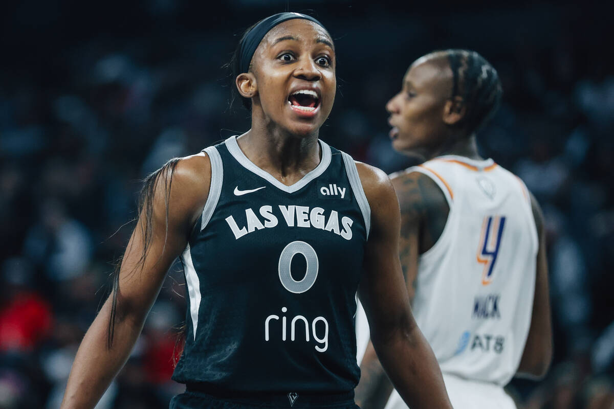 Aces guard Jackie Young (0) reacts to a referee not calling a foul during game one of a WNBA fi ...