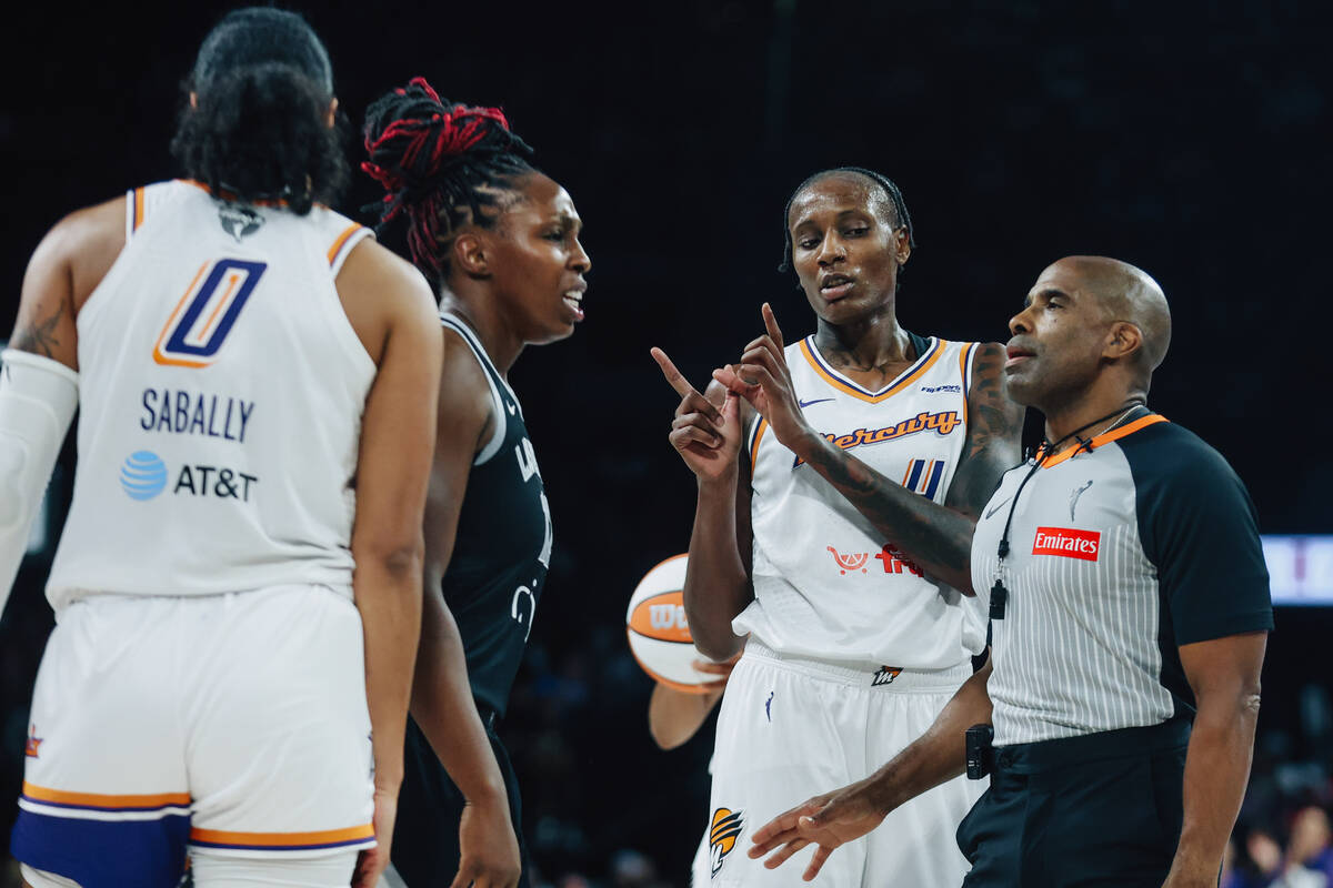 Phoenix Mercury forward Natasha Mack (4) makes a “w” gesture with her hands as Ac ...
