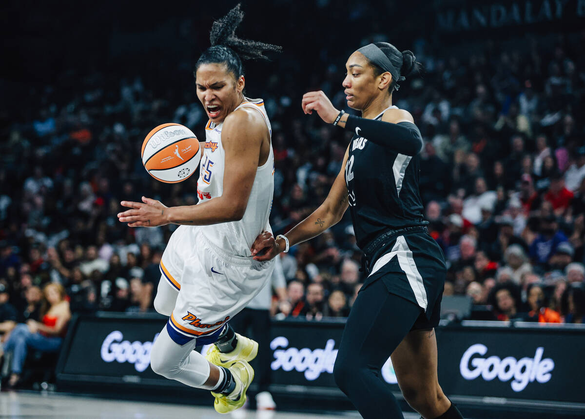 Phoenix Mercury forward Alyssa Thomas (25) yells as she falls while dribbling the ball during g ...