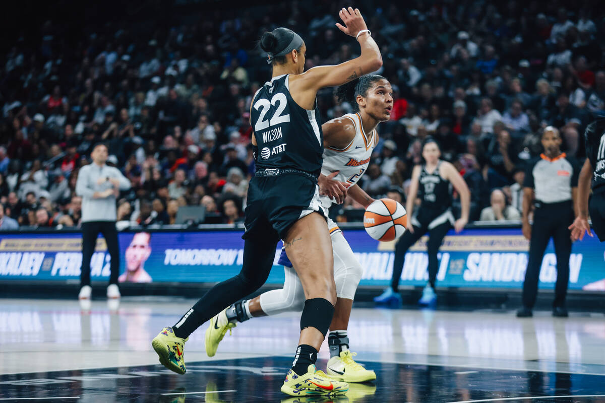 Aces center A'ja Wilson (22) guards Phoenix Mercury forward Alyssa Thomas (25) near the ba ...