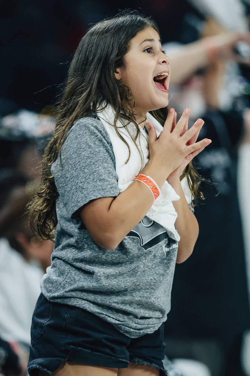 A young Aces fan yells during game one of a WNBA finals basketball game between the Aces and Ph ...