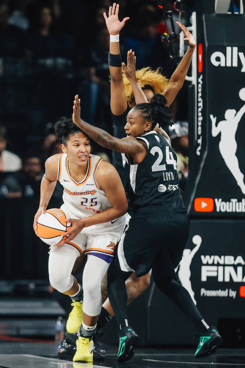 Aces guard Jewell Loyd (24) defends Phoenix Mercury forward Alyssa Thomas (25) during game one ...