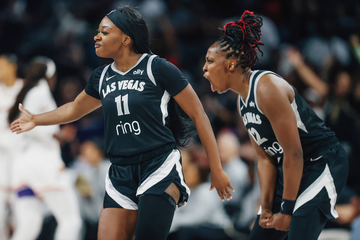 Aces guard Dana Evans (11) and Aces guard Chelsea Gray (12) celebrate during game one of a WNBA ...