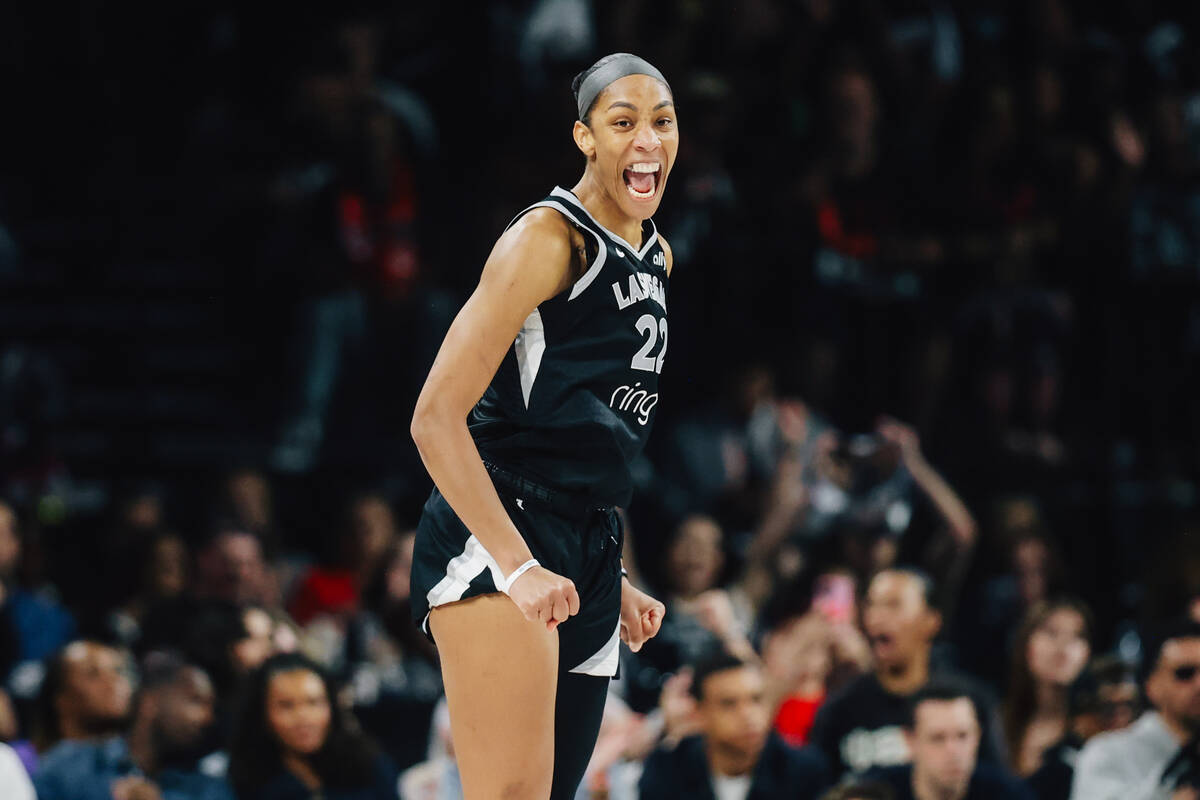 Aces center A'ja Wilson (22) celebrates during game one of a WNBA finals basketball game b ...
