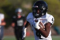 Las Vegas running back Steven Bullock (4) runs for a first half touchdown during a boys 5A high ...