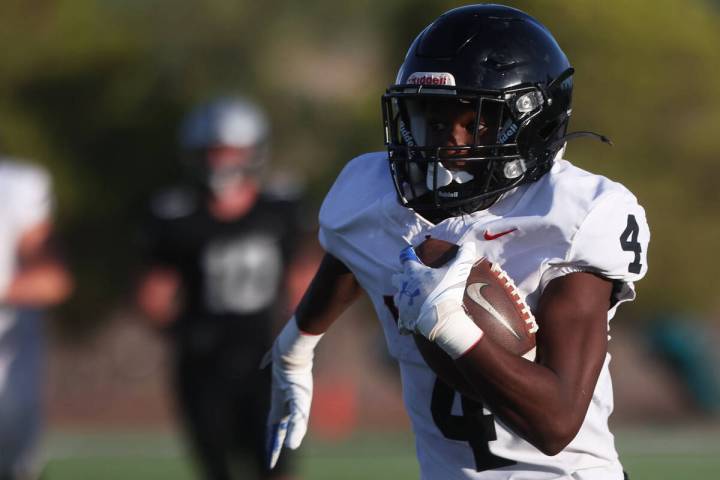 Las Vegas running back Steven Bullock (4) runs for a first half touchdown during a boys 5A high ...