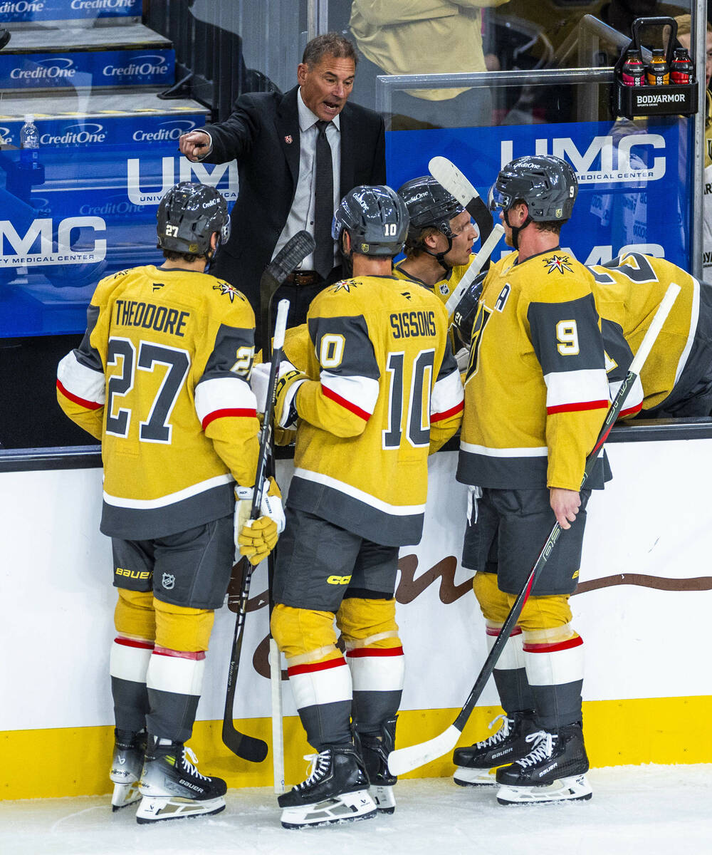 Golden Knights head coach Bruce Cassidy talks with his players against the Utah Mammoth during ...