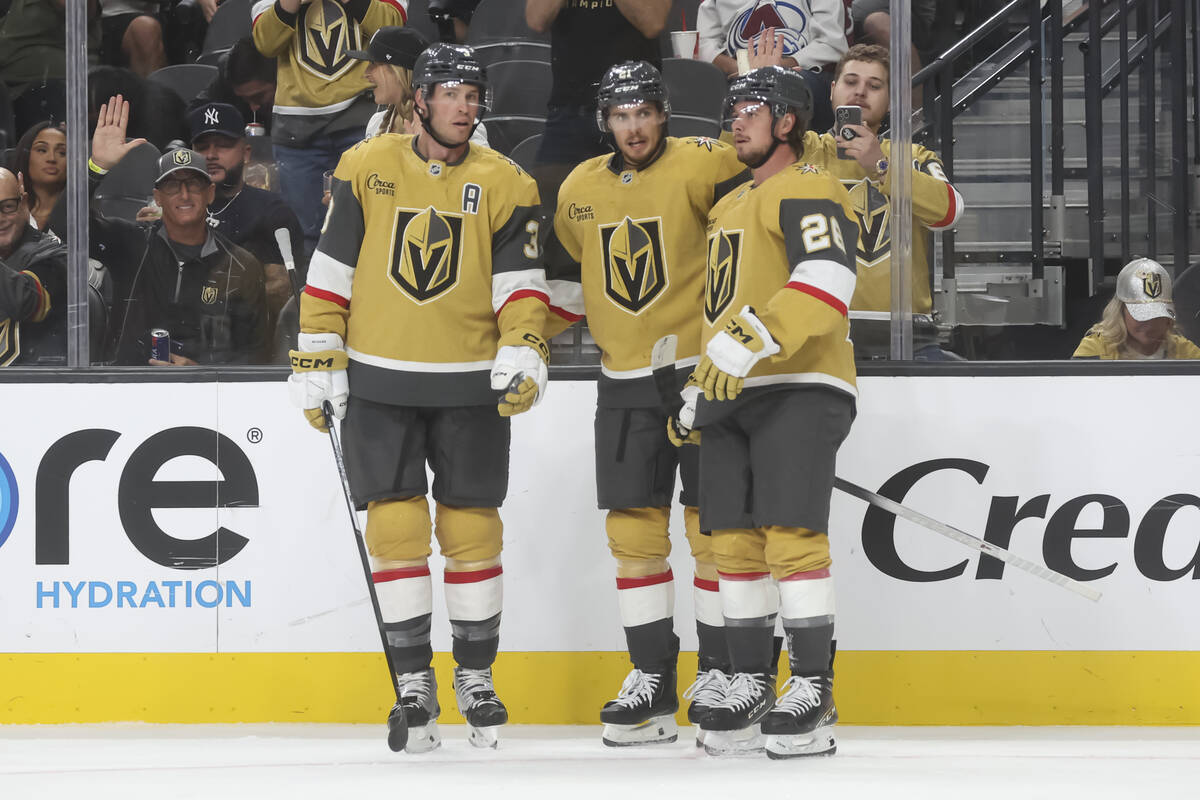 The Golden Knights celebrate after a goal against the Colorado Avalanche during the third perio ...