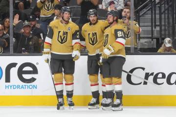 The Golden Knights celebrate after a goal against the Colorado Avalanche during the third perio ...