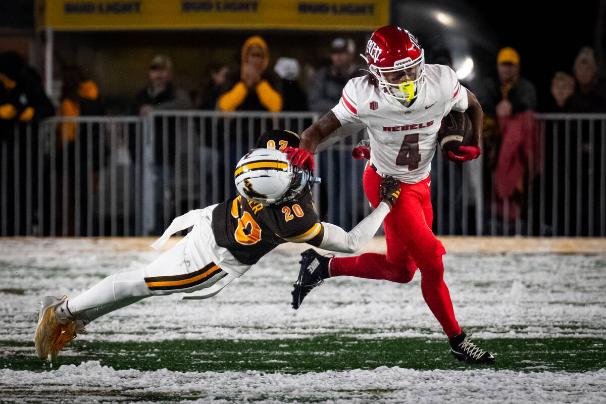 UNLV wide receiver DeAngelo Irvin Jr. Astiff arms University of Wyoming corner back Dainsus Mil ...