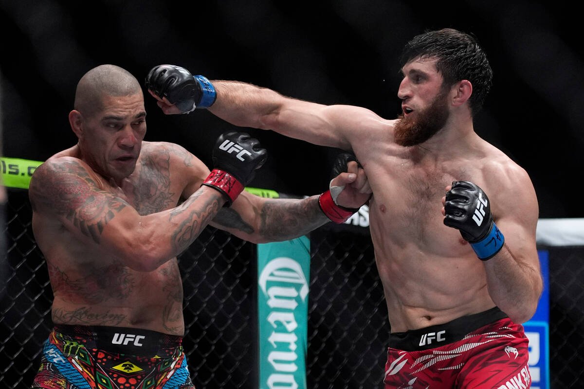 FILE - Alex Pereira, left, fights Magomed Ankalaev during a UFC 313 mixed martial arts light he ...
