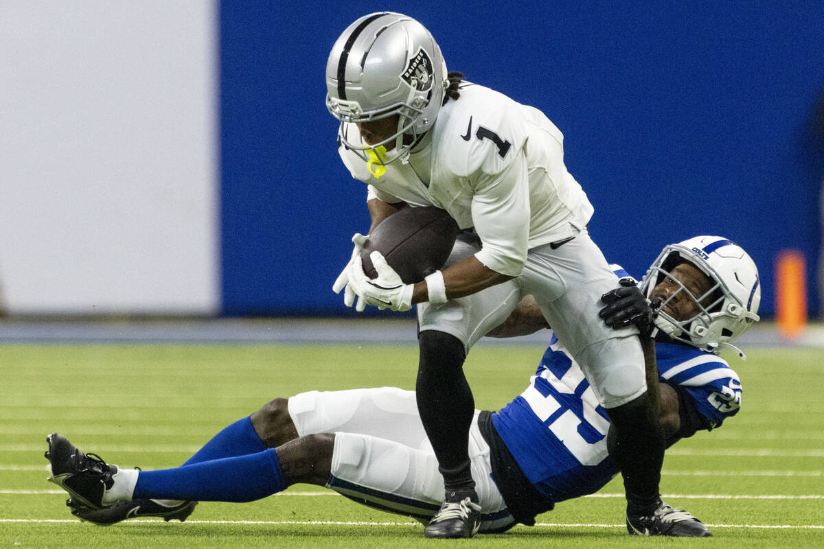 Raiders wide receiver Tre Tucker (1) is stopped by Indianapolis Colts cornerback Mekhi Blackmon ...