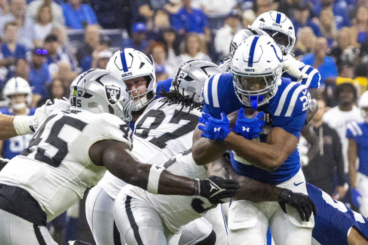 Raiders linebacker Devin White (45) attempts to stop Indianapolis Colts running back Jonathan T ...