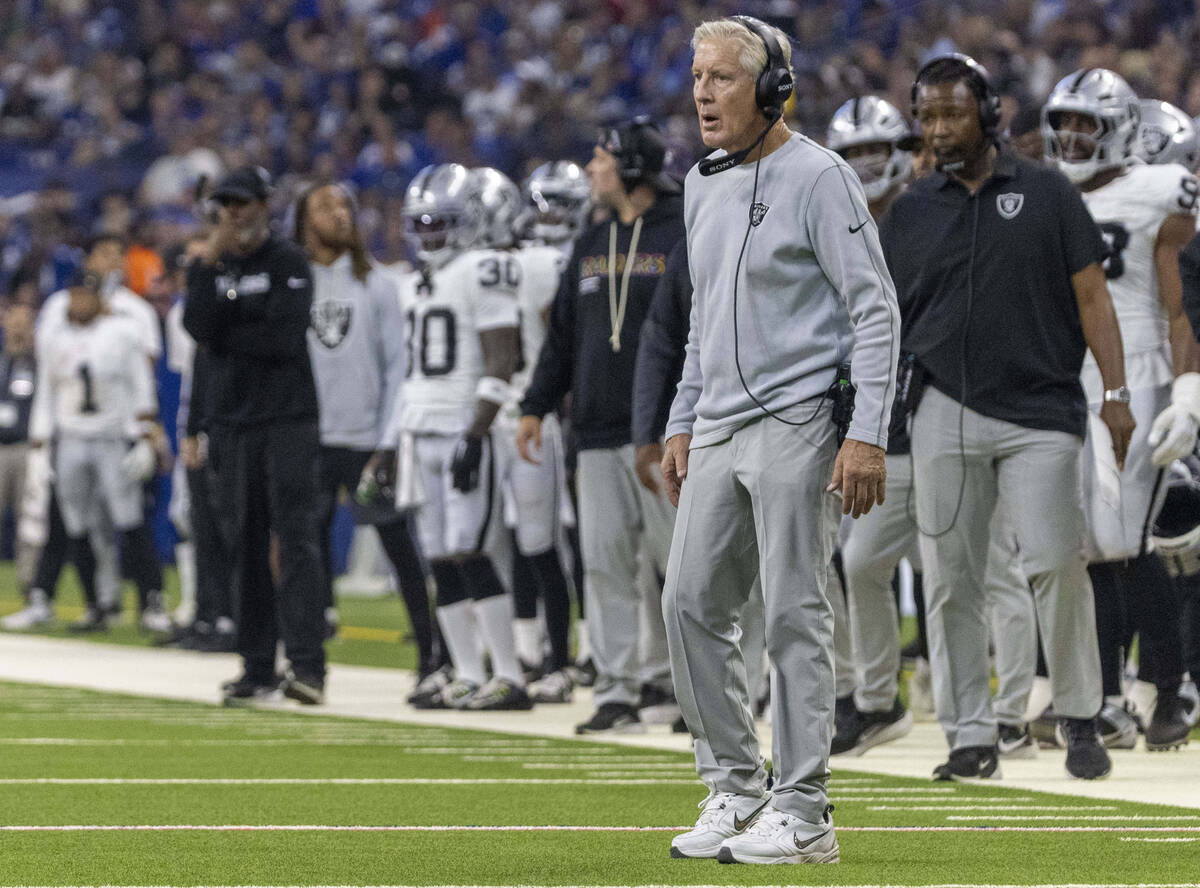 Raiders head coach Pete Carroll on the field during a timeout during the first half of an NFL g ...