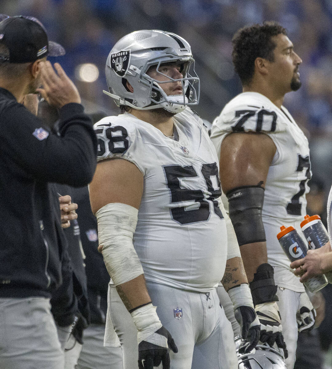 Raiders offensive lineman Jackson Powers-Johnson (58) watches the team play from the sideline d ...
