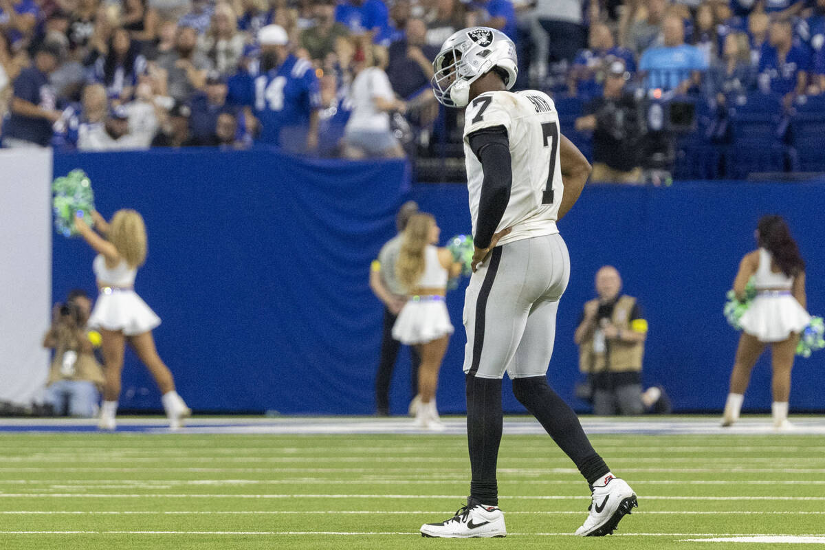 Raiders quarterback Geno Smith (7) stretches his neck during the second half of an NFL game aga ...