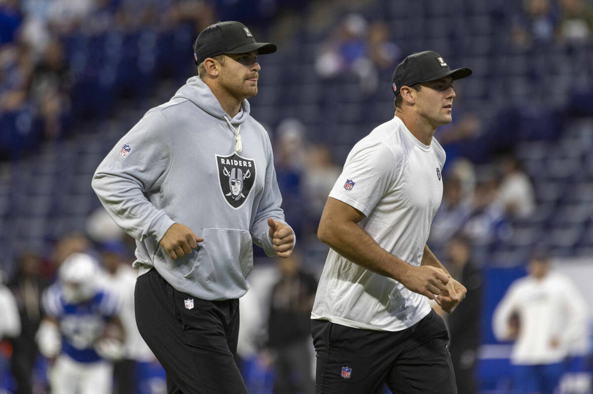 Raiders tight ends Michael Mayer, left, and Brock Bowers. run off of the field before an NFL ga ...