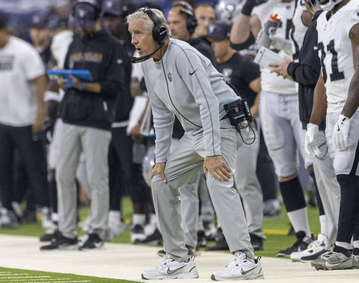 Raiders head coach Pete Carroll watches the game from the sideline during the first half of an ...