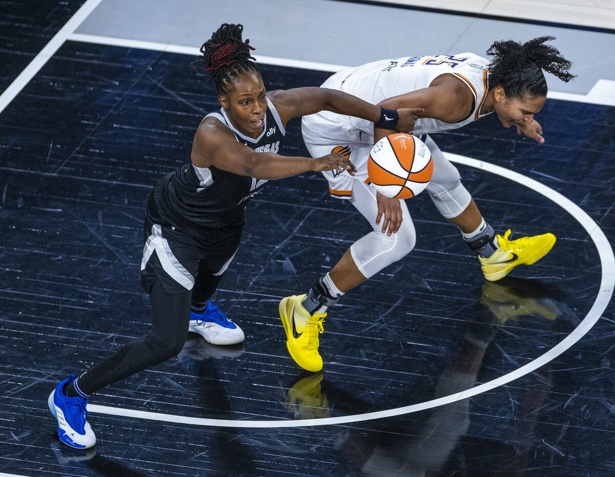 Aces guard Chelsea Gray (12) steals the ball from Phoenix Mercury forward Alyssa Thomas (25) du ...