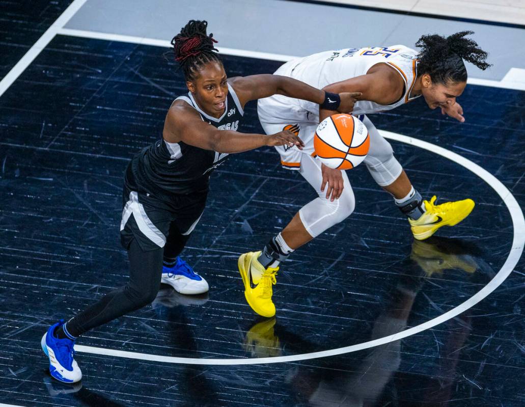 Aces guard Chelsea Gray (12) steals the ball from Phoenix Mercury forward Alyssa Thomas (25) du ...