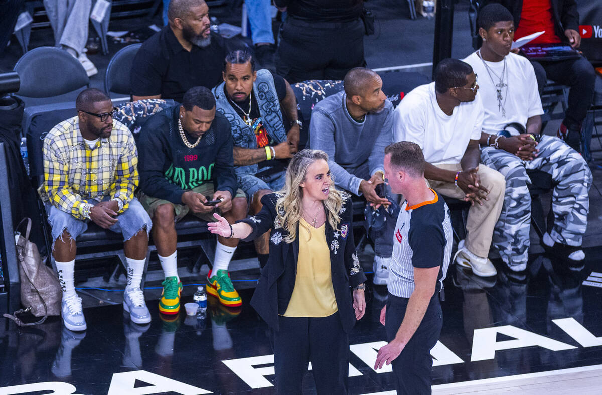 Aces head coach Becky Hammon talks with a referee in a timeout against the Phoenix Mercury duri ...
