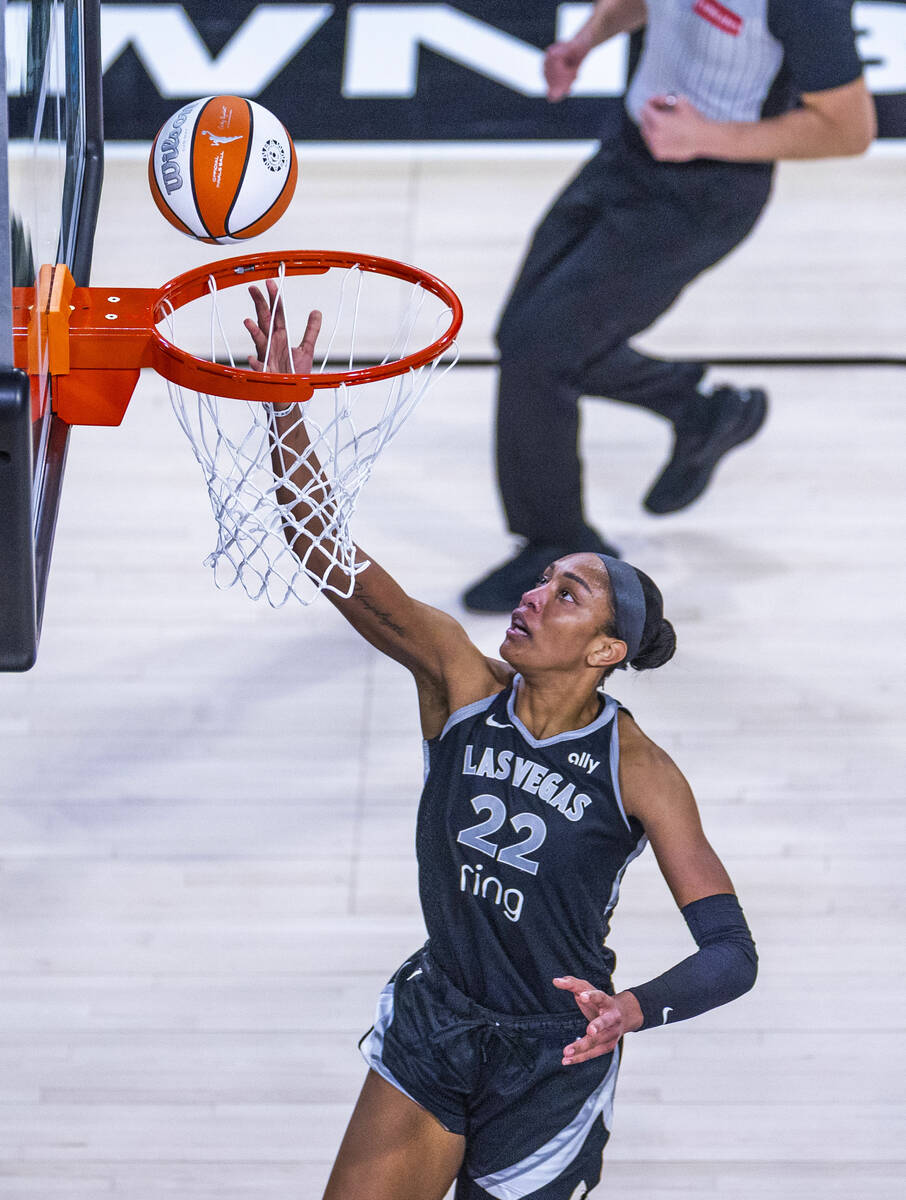 Aces center A'ja Wilson (22) lays up the ball on a fast break against the Phoenix Mercury ...