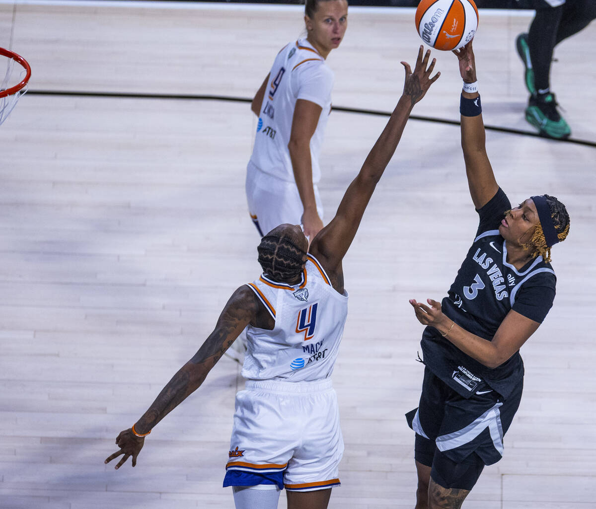 Aces forward NaLyssa Smith (3) elevates for a shot over Phoenix Mercury forward Natasha Mack (4 ...
