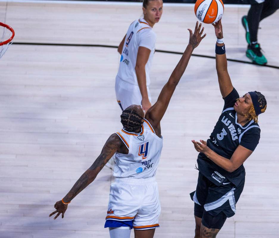 Aces forward NaLyssa Smith (3) elevates for a shot over Phoenix Mercury forward Natasha Mack (4 ...