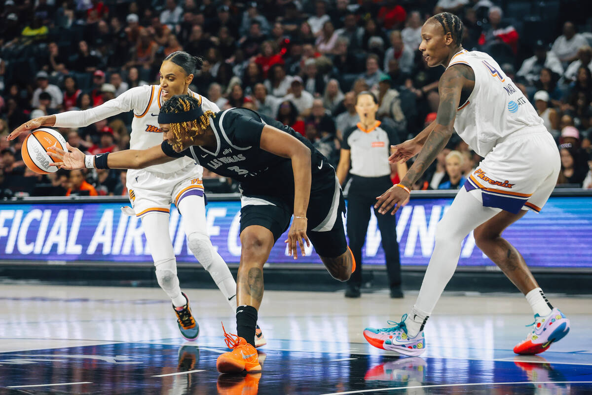 Aces forward NaLyssa Smith (3) reaches for a loose ball during game two of of a WNBA finals gam ...