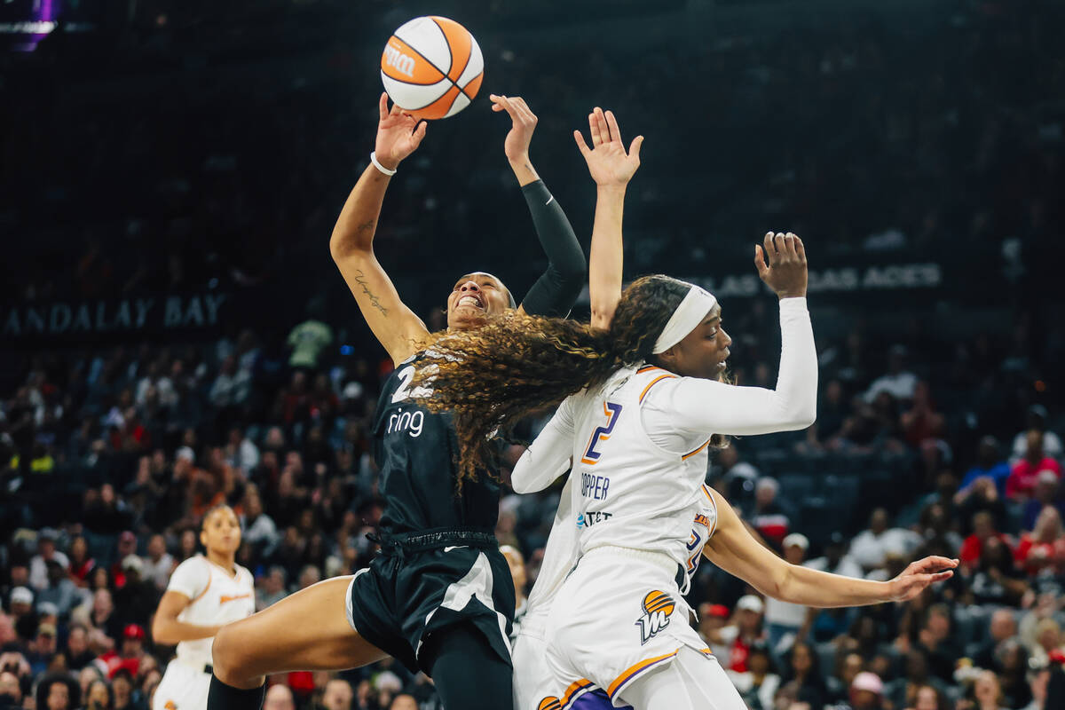 Aces center A'ja Wilson (22) fights for a basket during game two of of a WNBA finals game ...
