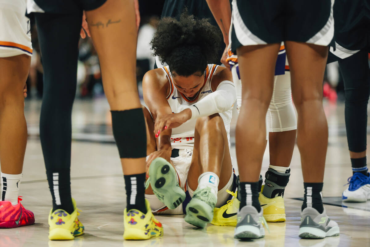 Phoenix Mercury forward Satou Sabally (0) takes. A moment before getting up from a brief injury ...