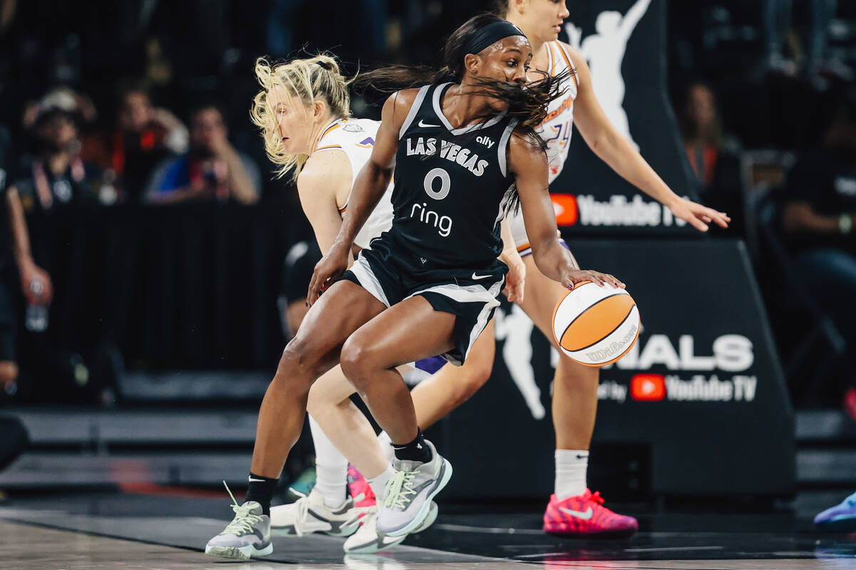 Aces guard Jackie Young (0) dribbles the ball during game two of of a WNBA finals game between ...